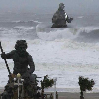 Godzilla rises from the Virginia Beach Surf Behind King Neptune