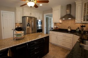 remodeled kitchen in yorktown virginia with custom cabinets, kitchen island, tiled backsplash, granite countertops